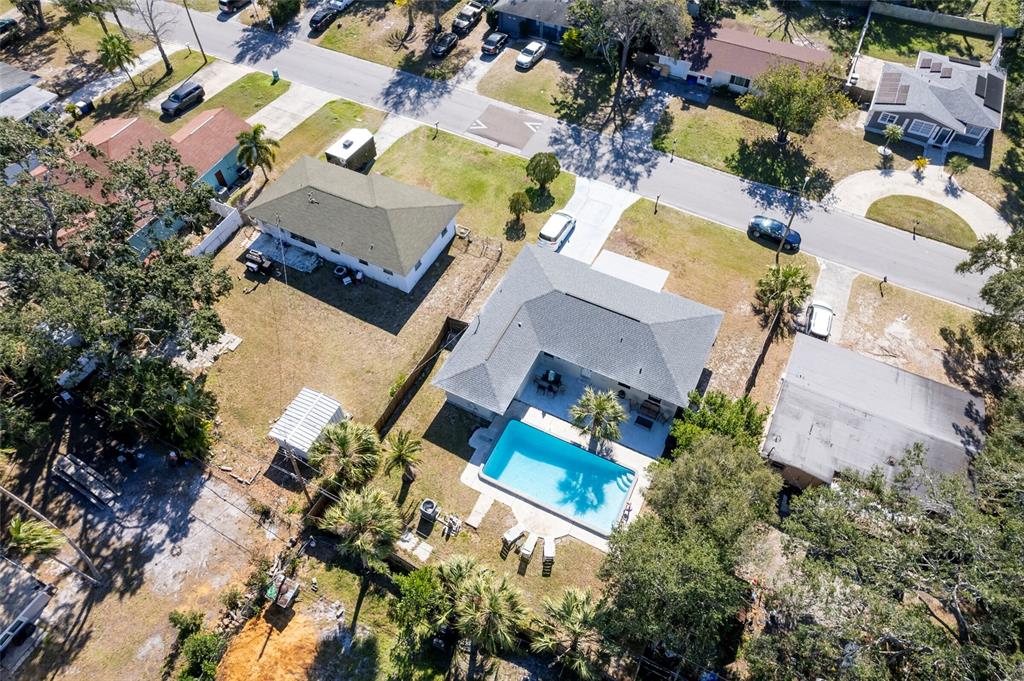 1344 Springdale Street Clearwater, FL 33755 - Photo 33 of 34 an aerial view of a house with a yard and swimming pool
