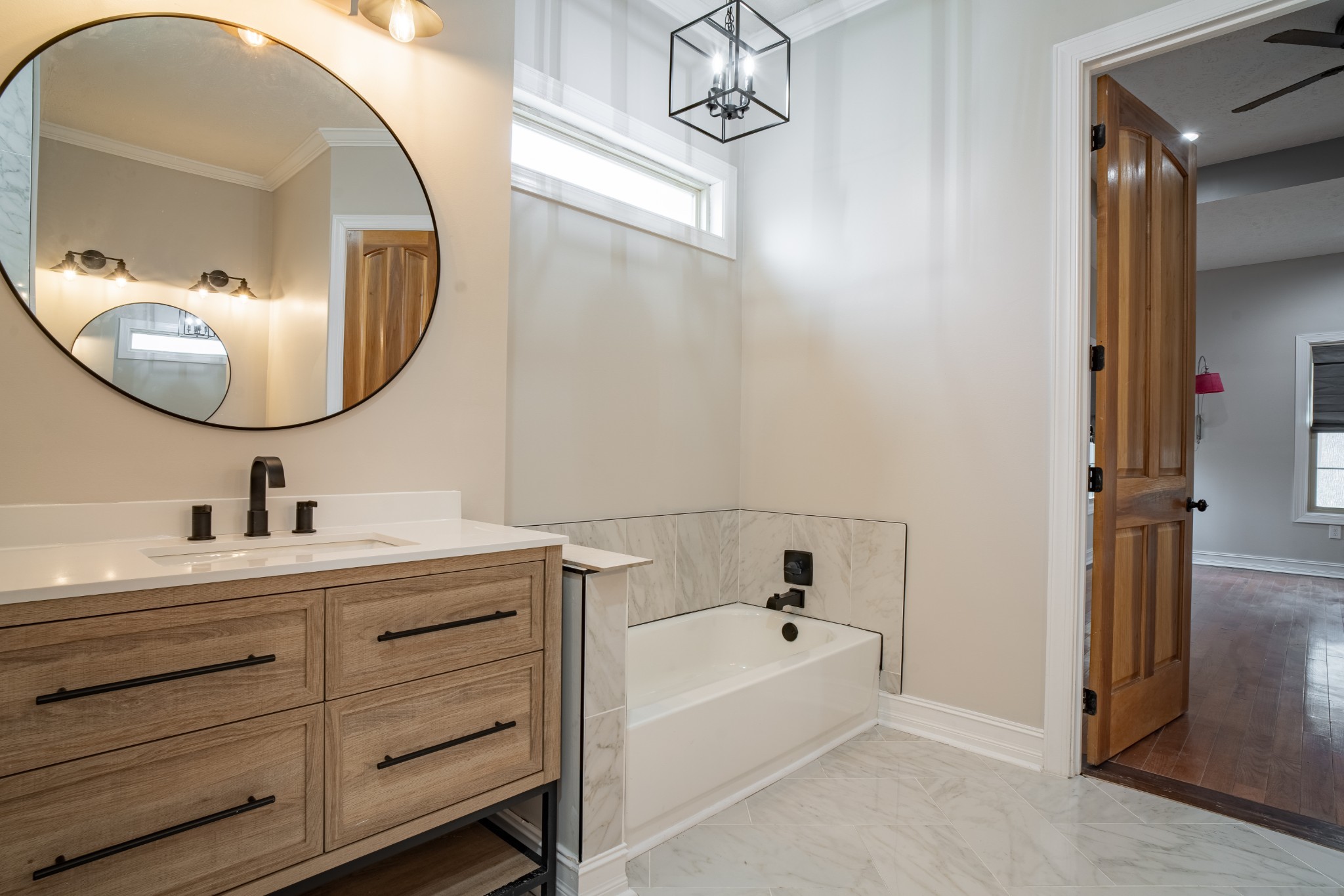 550 Laurel Crown Road Manchester, TN 37355 - Photo 59 of 87 a bathroom with a tub sink and mirror
