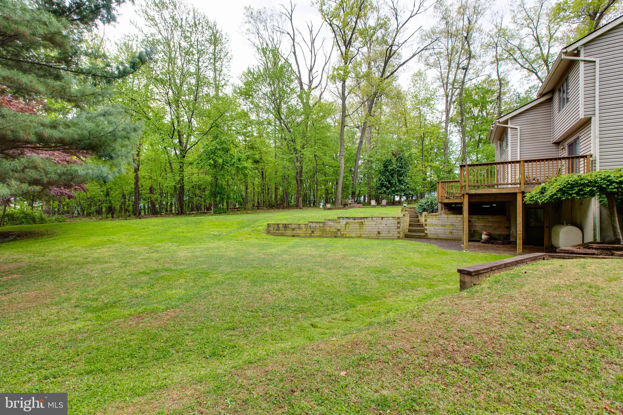 5519 Woodbine Road Sykesville, MD 21784 - Photo 55 of 69 a view of outdoor space with deck and yard