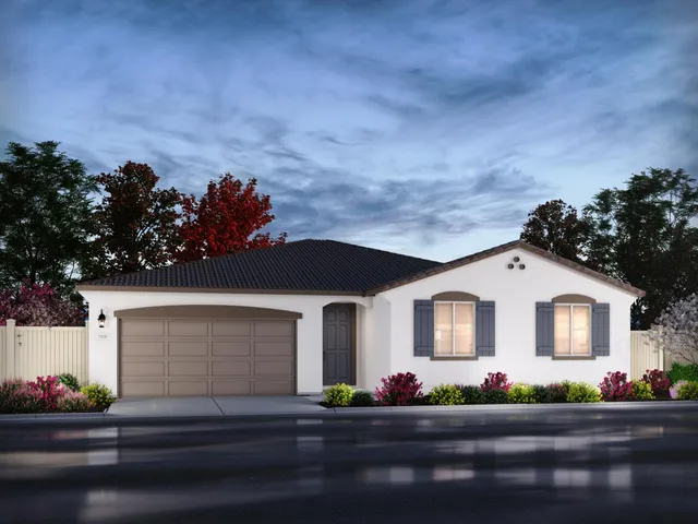 a front view of a house with lots of green space
