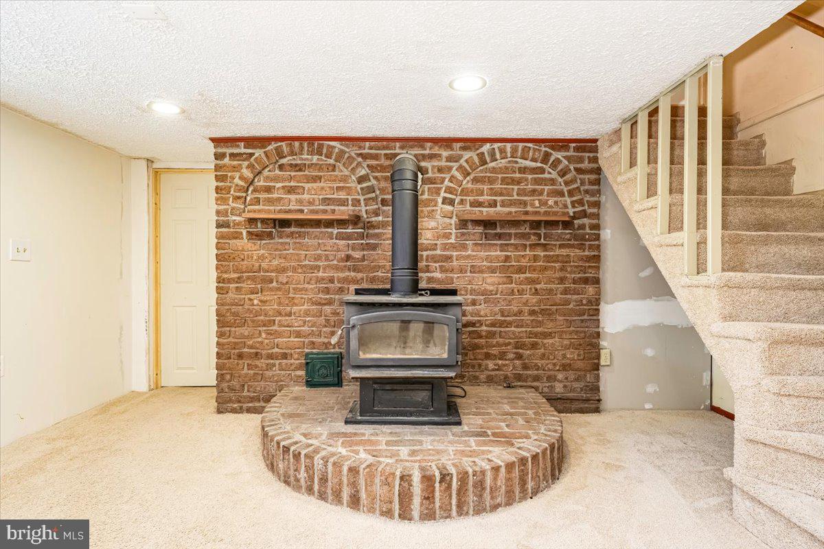 5968 Grove Hill Road Frederick, MD 21703 - Photo 18 of 43 Basement Woodburning Stove