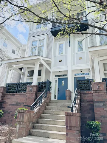 a front view of a building with large windows