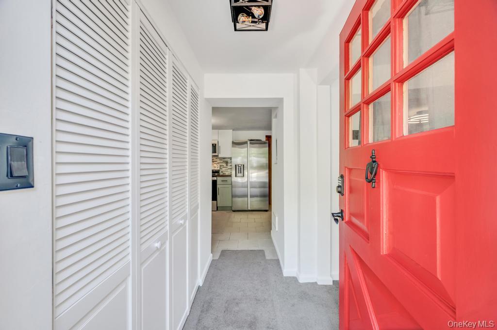 5 Panther Path Miller Place, NY 11764 - Photo 13 of 37 Hallway featuring light carpet and baseboards