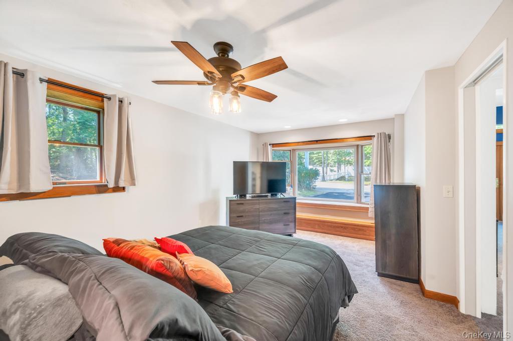 5 Panther Path Miller Place, NY 11764 - Photo 20 of 37 Carpeted bedroom featuring a ceiling fan and baseboards