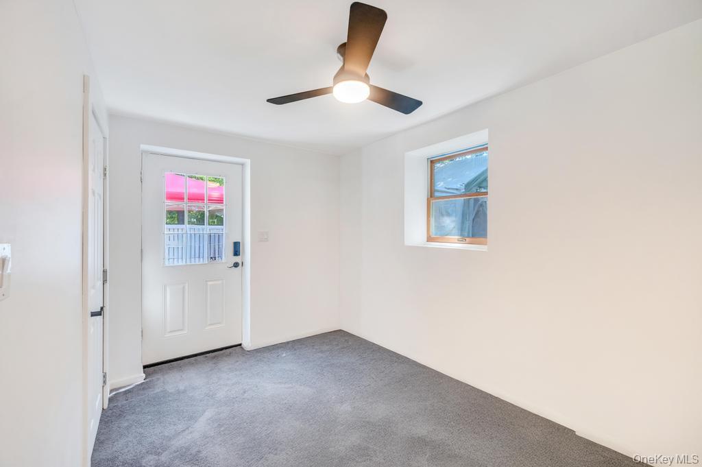 5 Panther Path Miller Place, NY 11764 - Photo 22 of 37 Spare room featuring carpet flooring and a ceiling fan