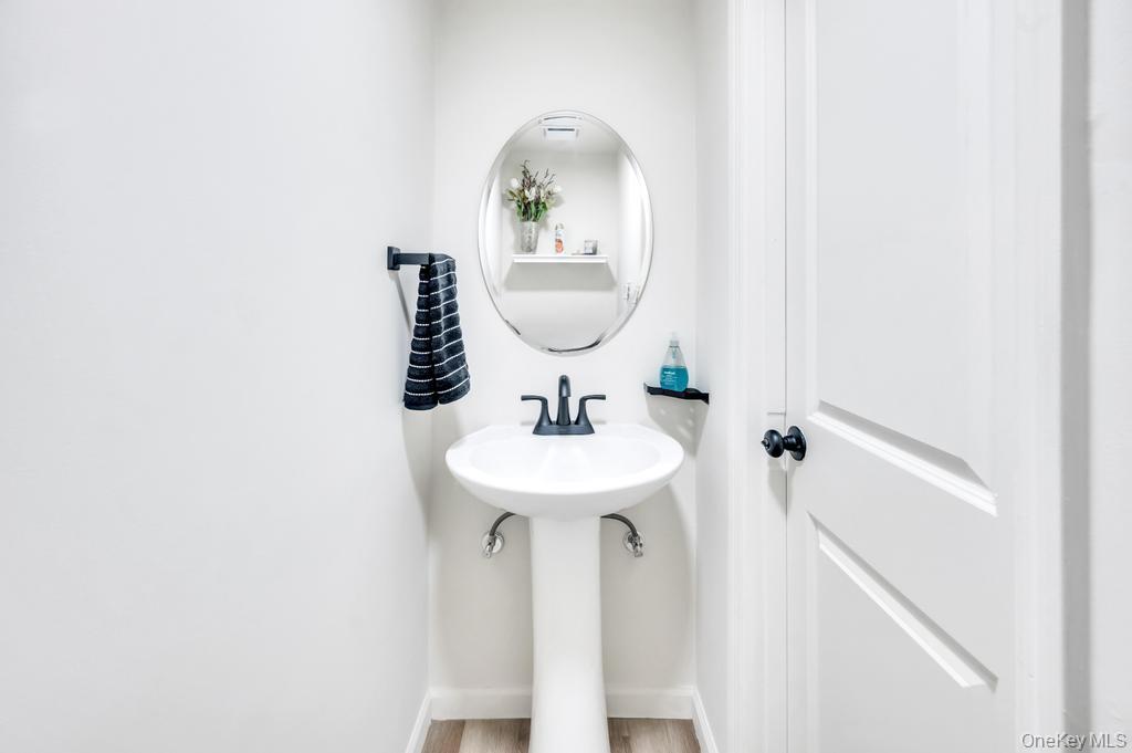 5 Panther Path Miller Place, NY 11764 - Photo 30 of 37 Bathroom with baseboards and light wood finished floors