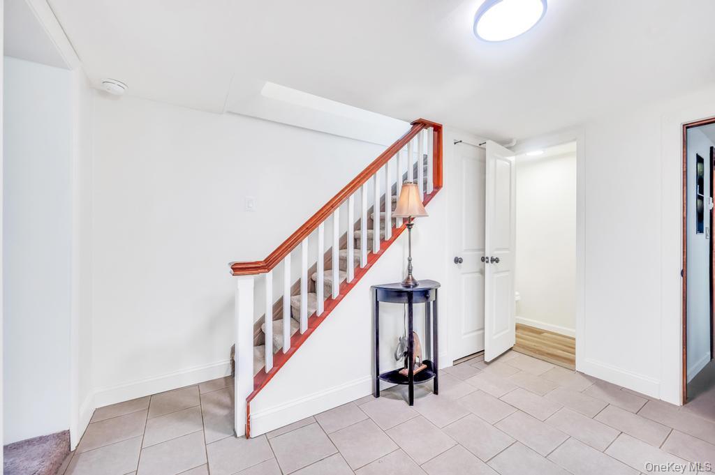 5 Panther Path Miller Place, NY 11764 - Photo 31 of 37 Stairway featuring tile patterned floors