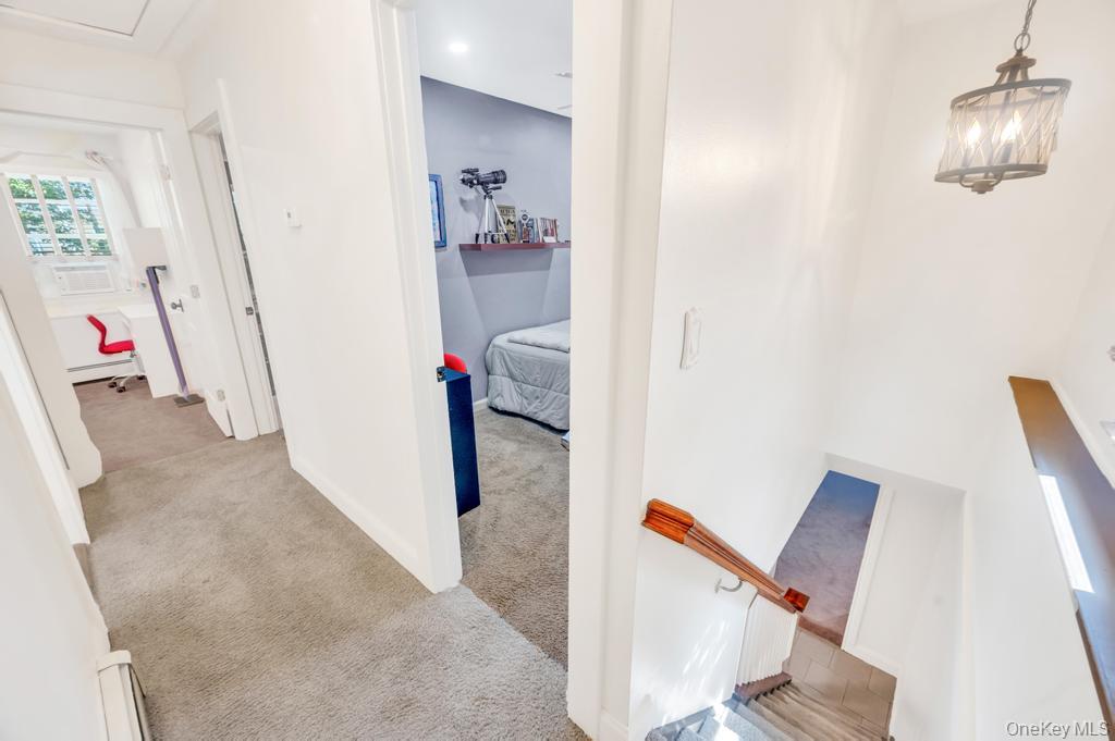 5 Panther Path Miller Place, NY 11764 - Photo 37 of 37 Corridor with light colored carpet and baseboard heating
