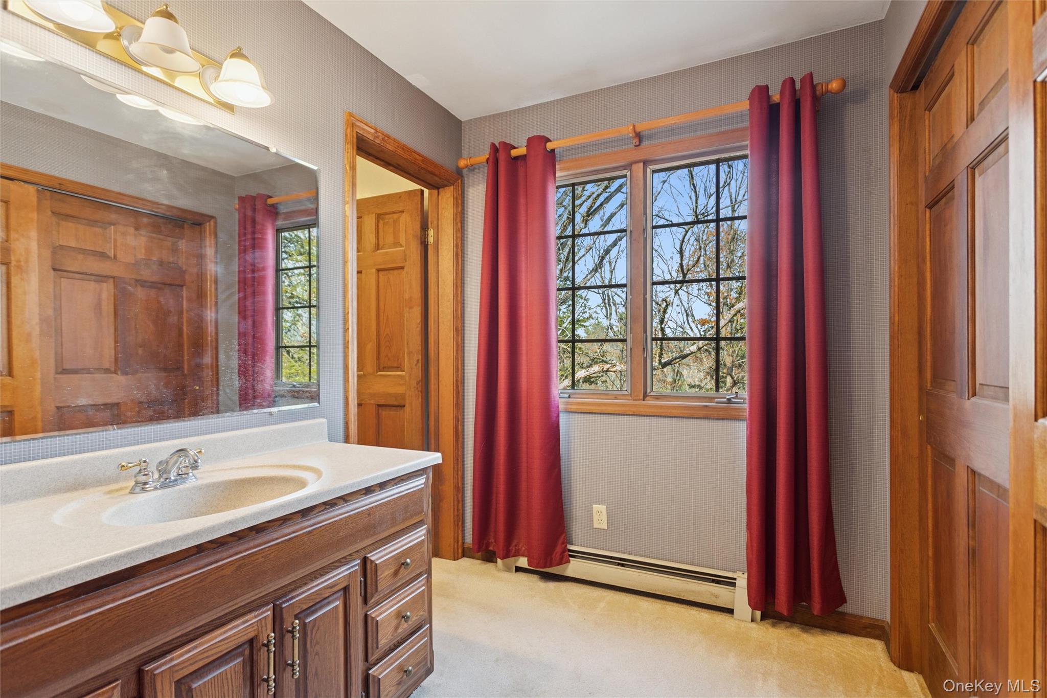 686 Traver Road Pleasant Valley, NY 12569 - Photo 27 of 37 a bathroom with a granite countertop sink a mirror and a shower