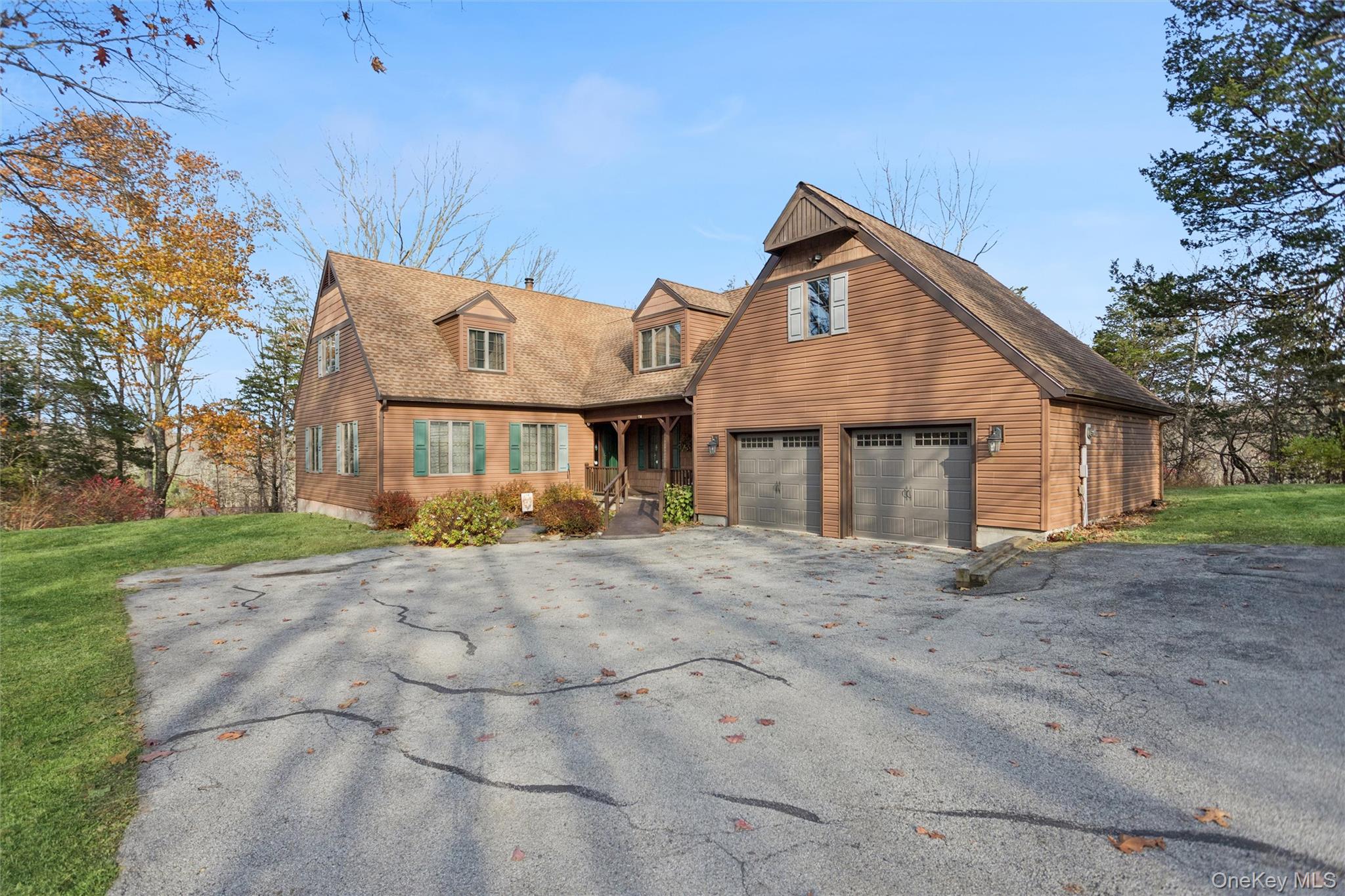 686 Traver Road Pleasant Valley, NY 12569 - Photo 3 of 37 a front view of a house with a yard and garage