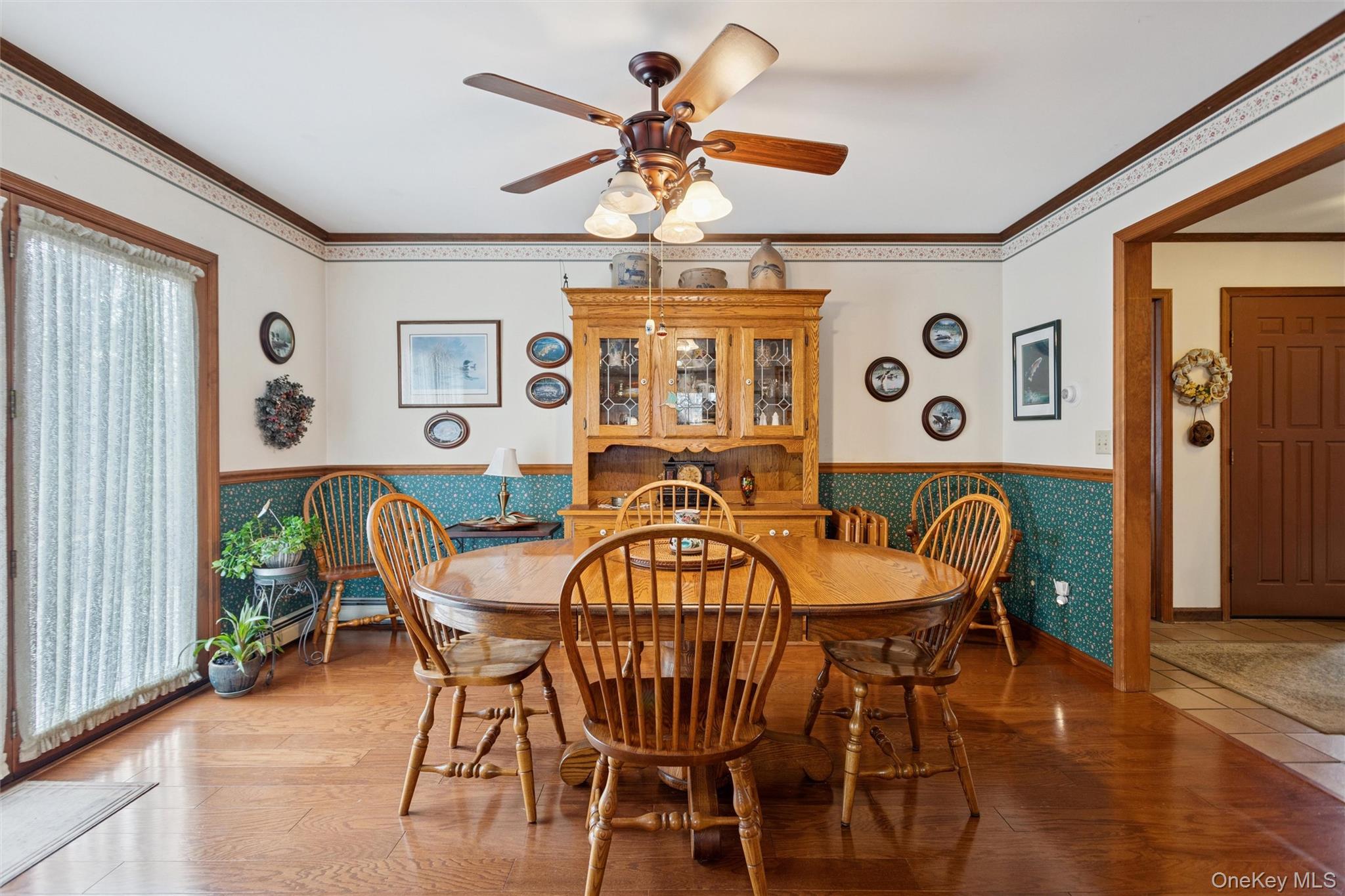 686 Traver Road Pleasant Valley, NY 12569 - Photo 7 of 37 a dining room with furniture a chandelier and wooden floor