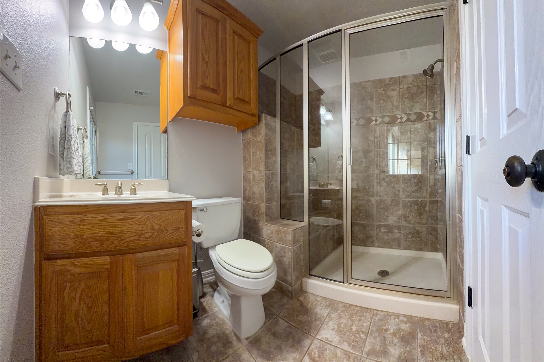 748 Nelson Ranch Road Cedar Park, TX 78613 - Photo 12 of 24 a bathroom with a shower a toilet and sink