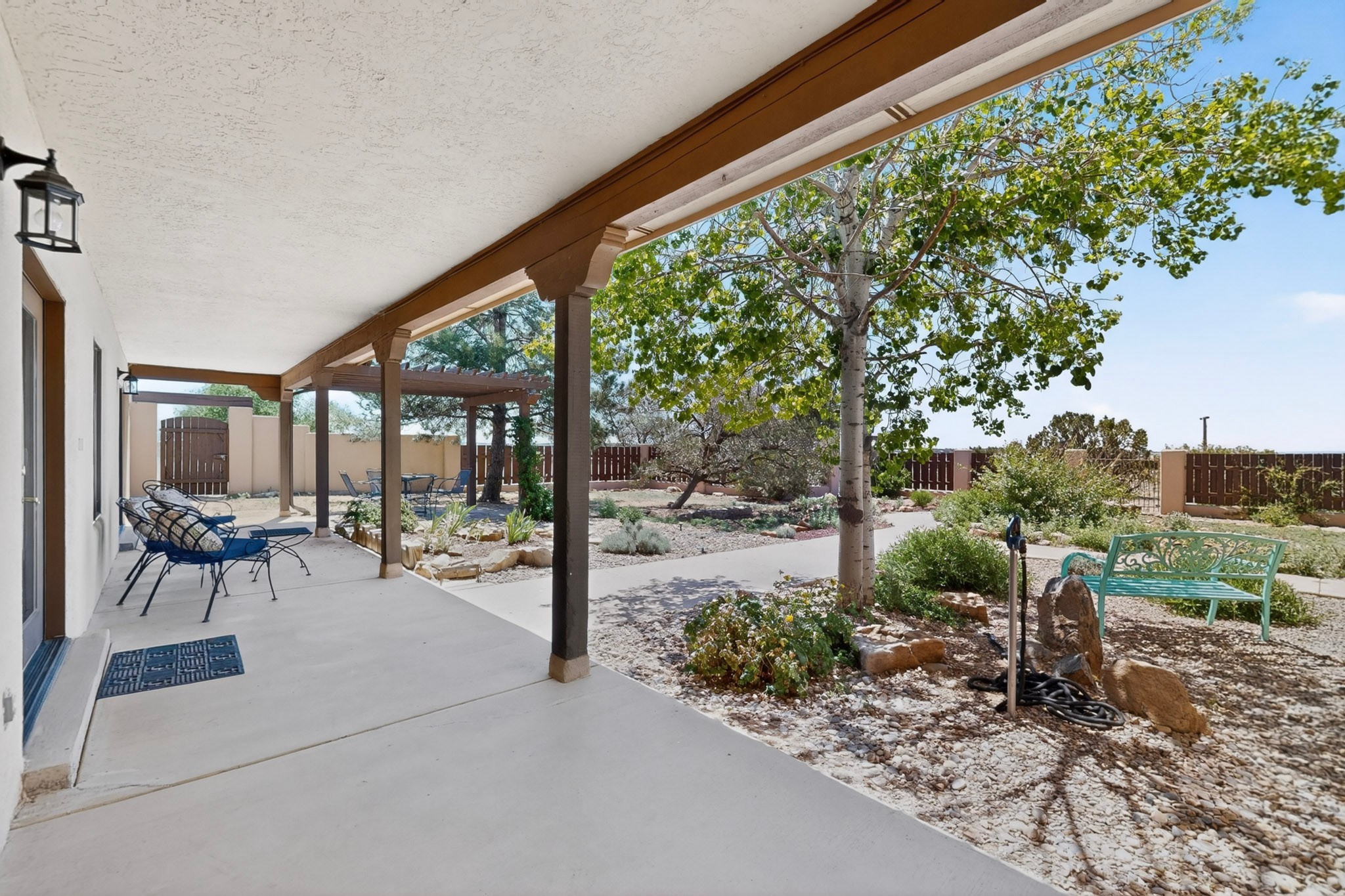 10 Blue Mesa Road Santa Fe, NM 87508 - Photo 4 of 63 Front garden portal. The currently used front door on the left