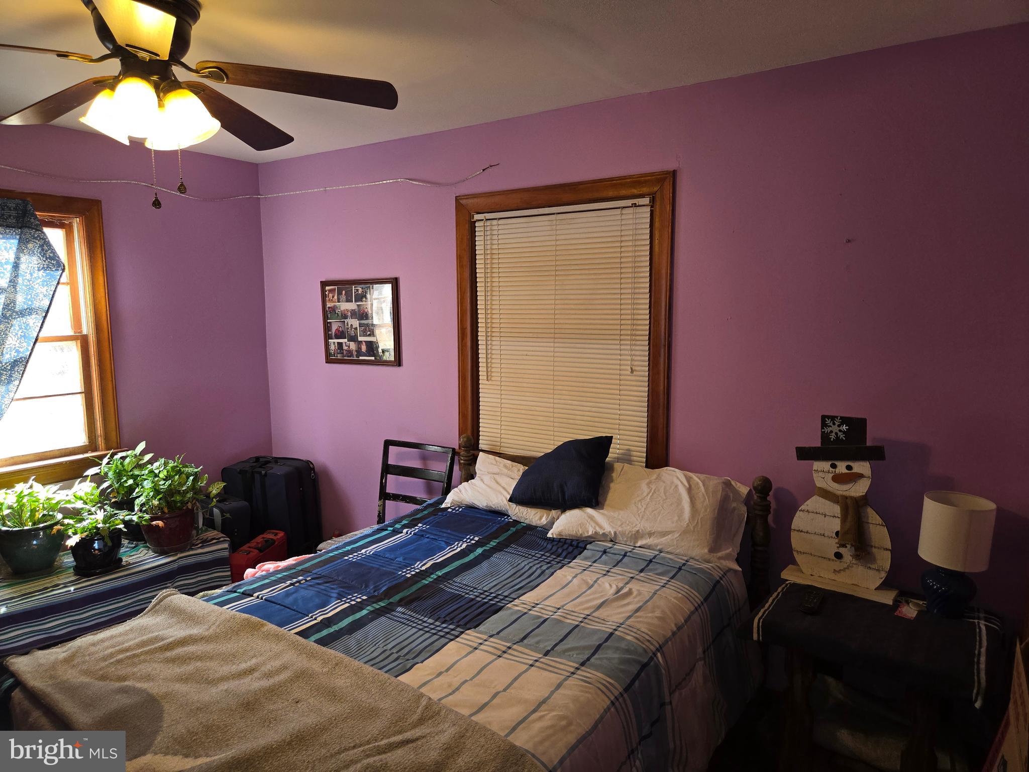 2996 Etlan Road Etlan, VA 22719 - Photo 11 of 24 a bedroom with a bed and a chandelier