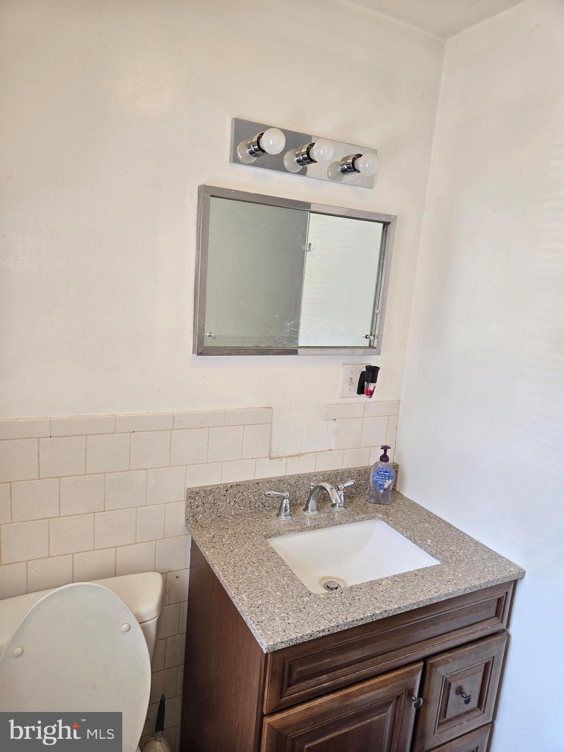 2996 Etlan Road Etlan, VA 22719 - Photo 12 of 24 a bathroom with a sink a toilet and mirror