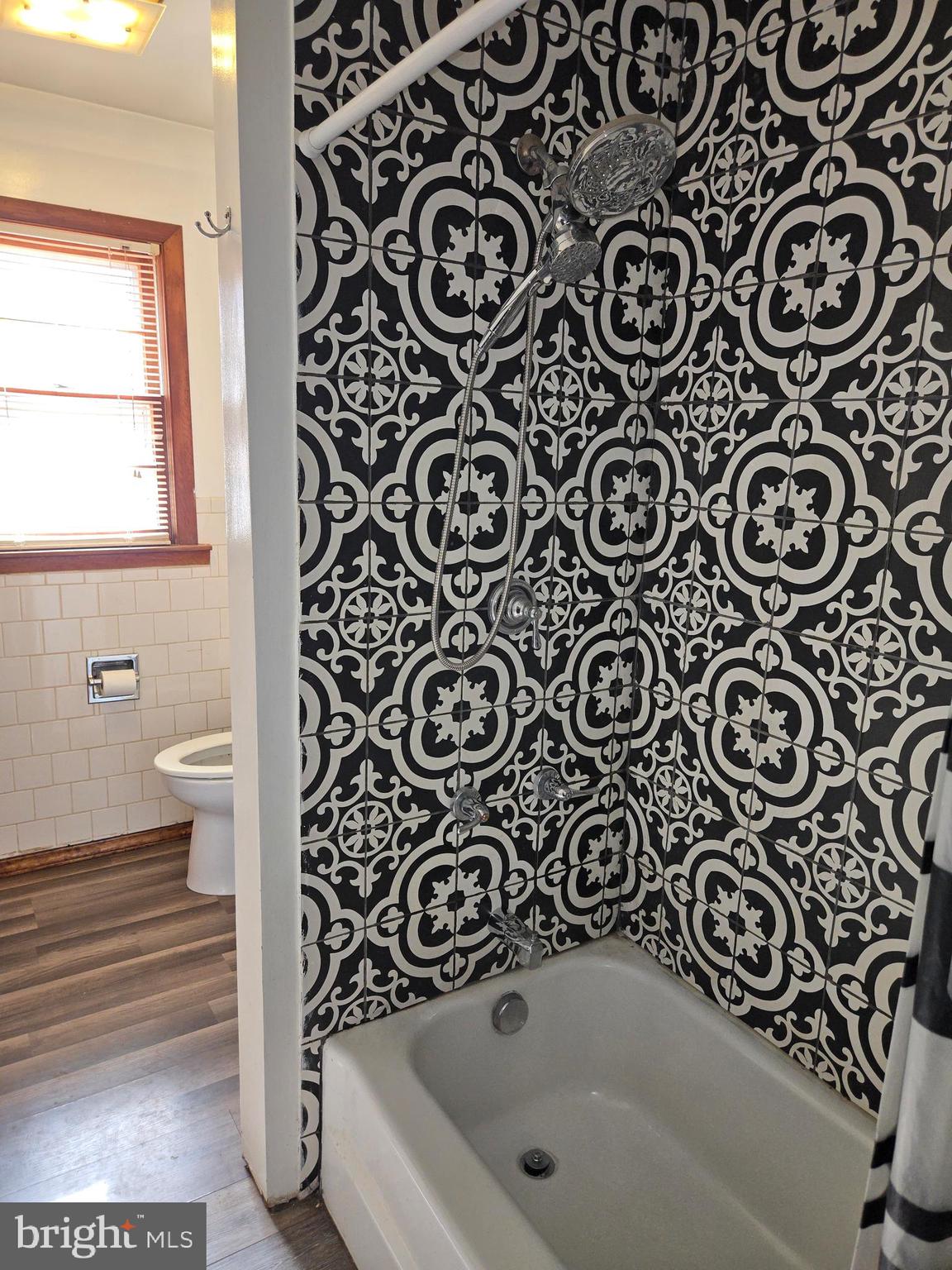 2996 Etlan Road Etlan, VA 22719 - Photo 13 of 24 a bathroom with a bathtub and a window