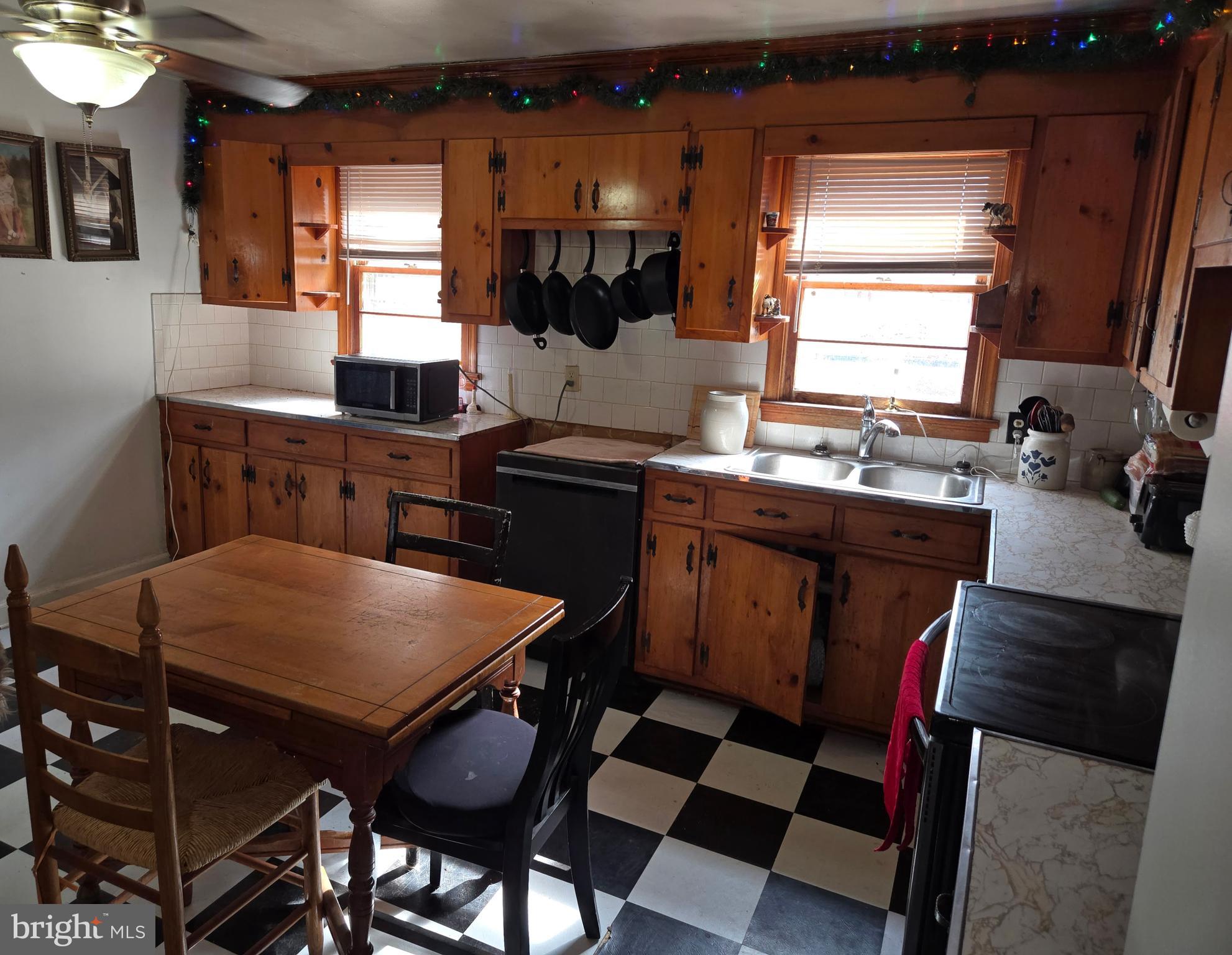 2996 Etlan Road Etlan, VA 22719 - Photo 8 of 24 a kitchen with a table chairs and a sink
