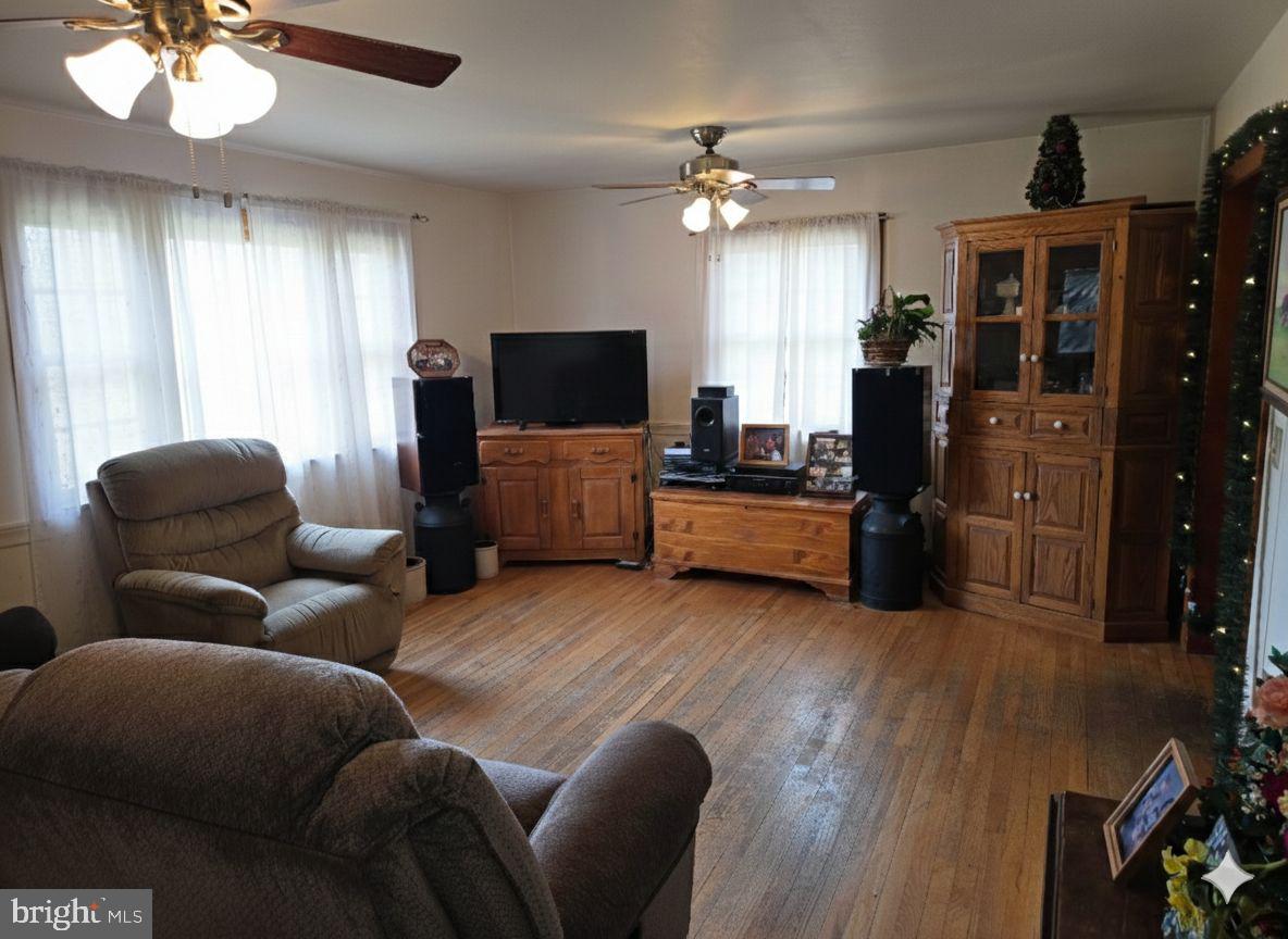 2996 Etlan Road Etlan, VA 22719 - Photo 9 of 24 a living room with furniture and a flat screen tv
