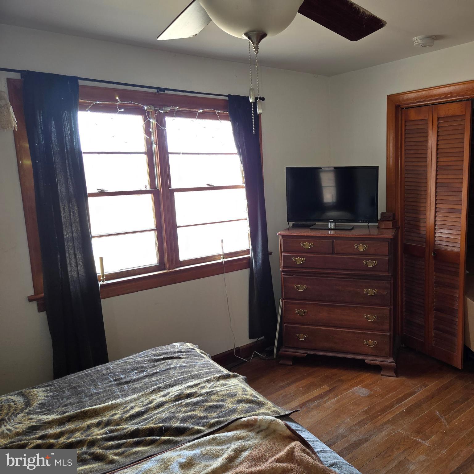 2996 Etlan Road Etlan, VA 22719 - Photo 10 of 24 a bedroom with a bed and a flat screen tv