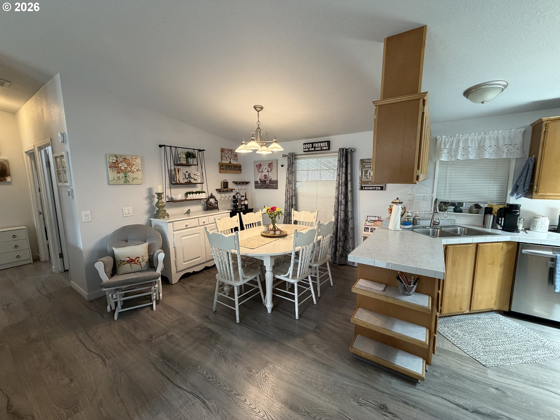 1699 North Terry Street, Unit 351 Eugene, OR 97402 - Photo 7 of 23 a dining room with furniture and wooden floor