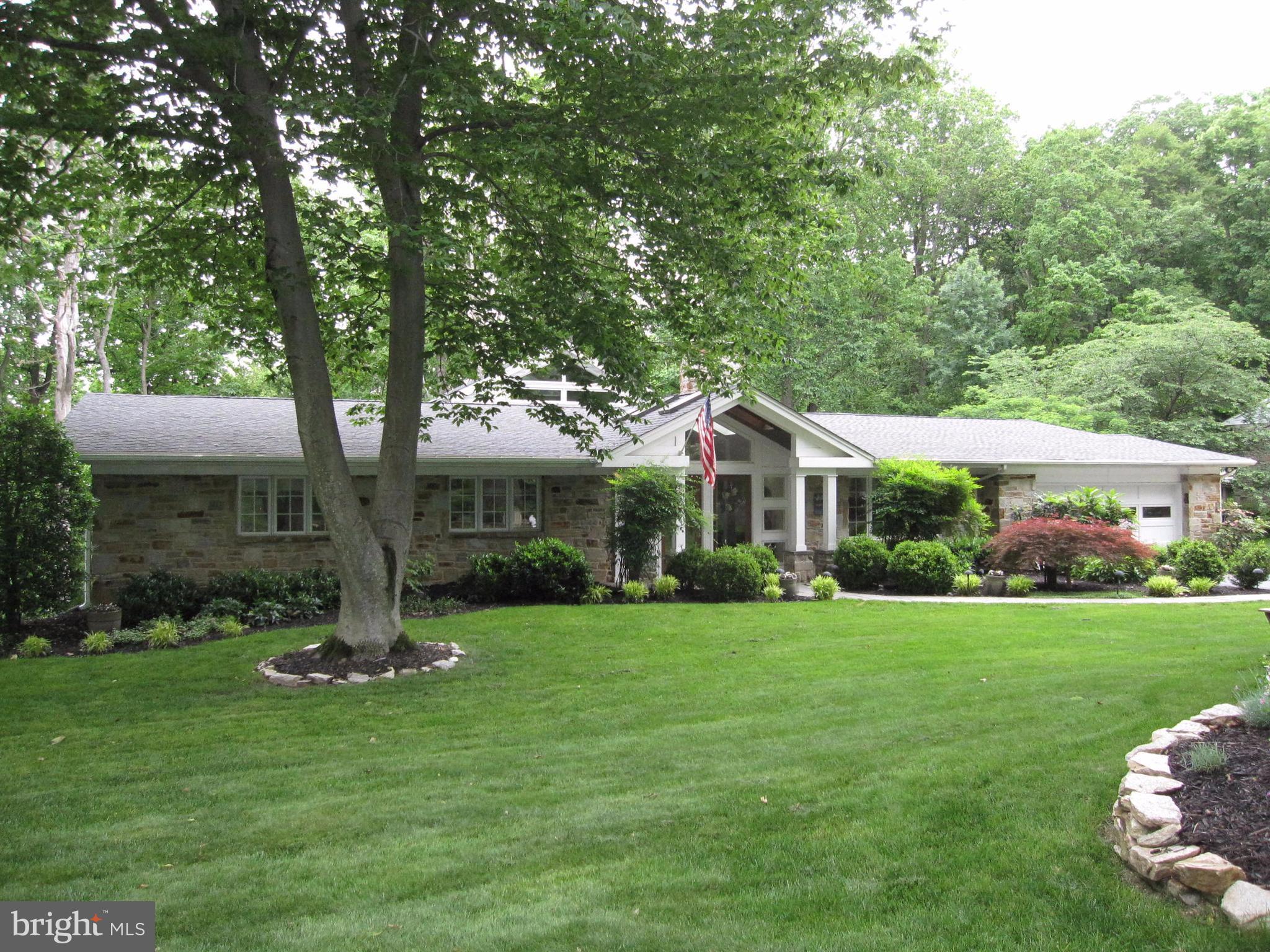 906 Huntsman Road Baltimore, MD 21286 - Photo 2 of 30 a front view of a house with a garden