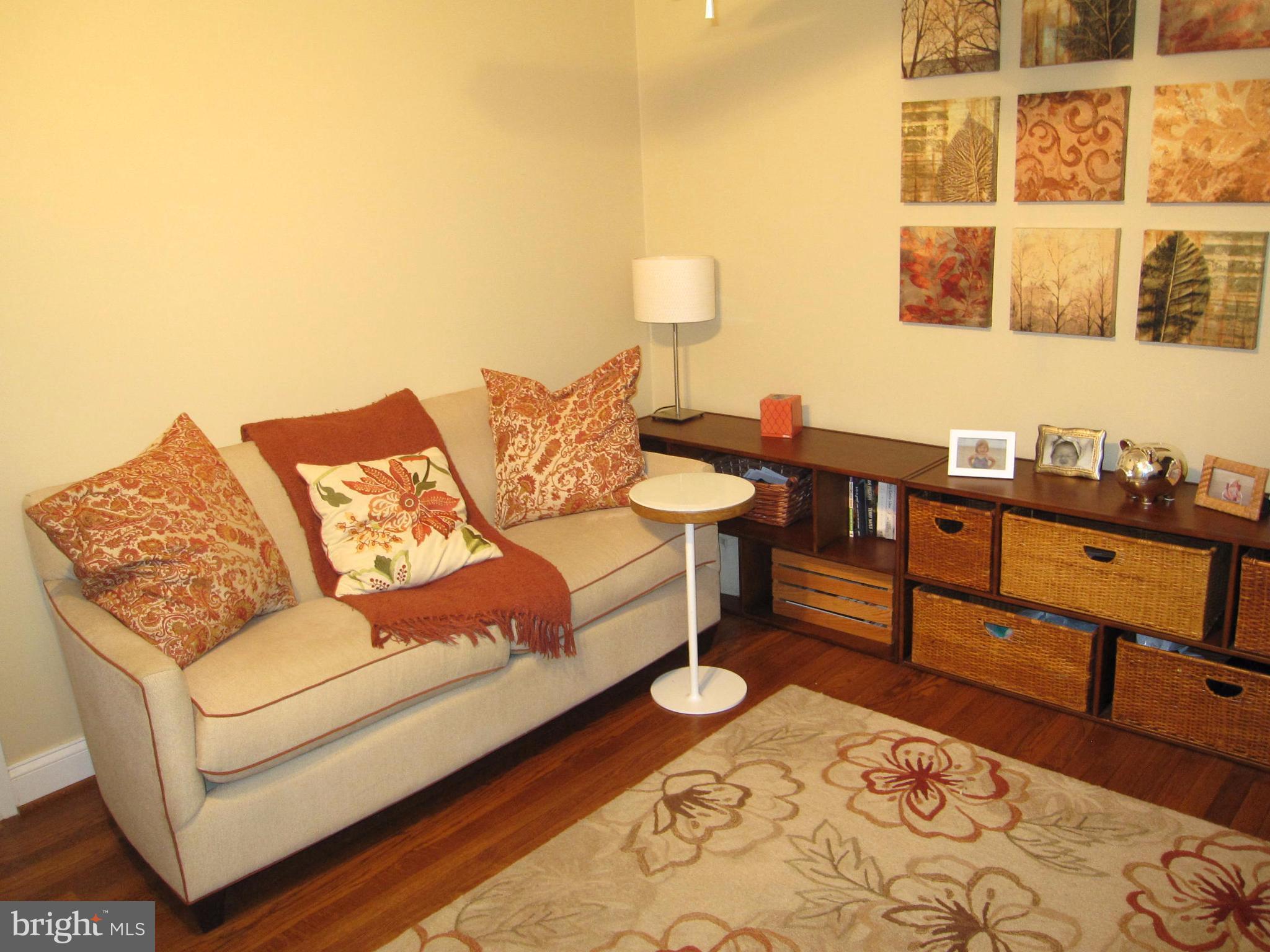 906 Huntsman Road Baltimore, MD 21286 - Photo 22 of 30 a living room with furniture and a wooden floor