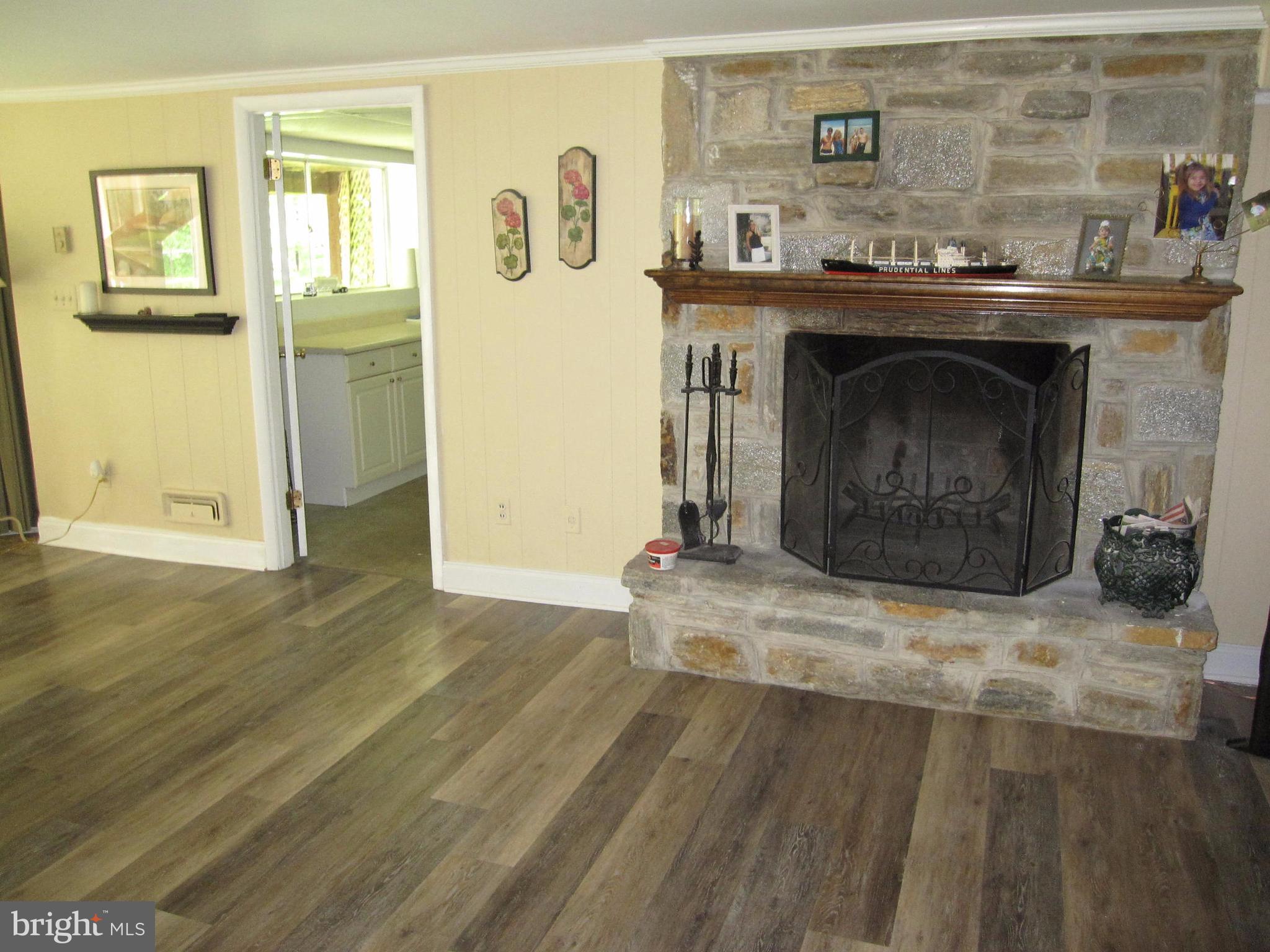 906 Huntsman Road Baltimore, MD 21286 - Photo 26 of 30 a living room with granite countertop furniture and a fireplace