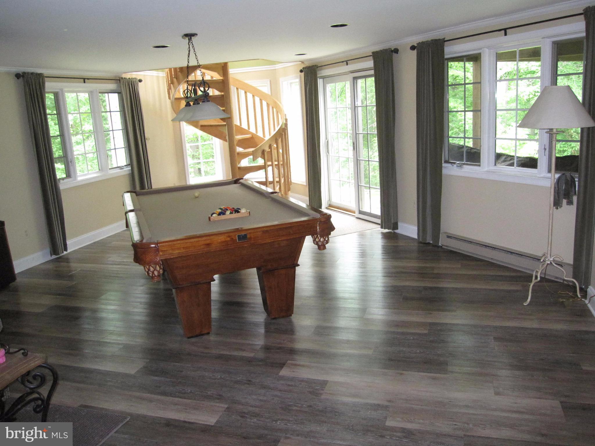 906 Huntsman Road Baltimore, MD 21286 - Photo 27 of 30 a view of a room with wooden floor and staircase