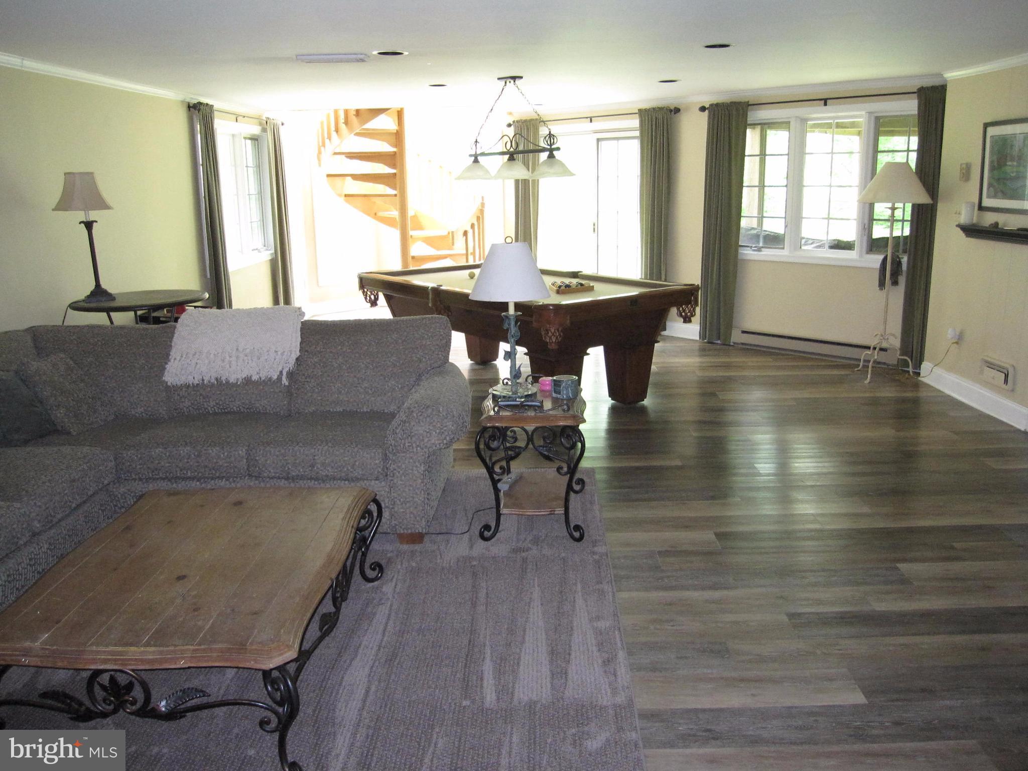 906 Huntsman Road Baltimore, MD 21286 - Photo 28 of 30 a dining room with furniture and wooden floor
