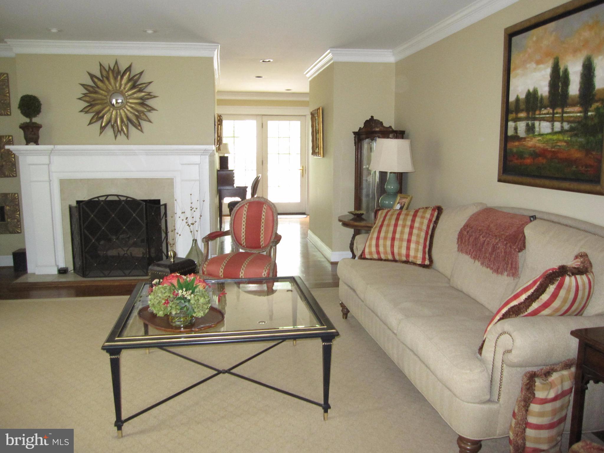 906 Huntsman Road Baltimore, MD 21286 - Photo 7 of 30 a living room with furniture and a fireplace