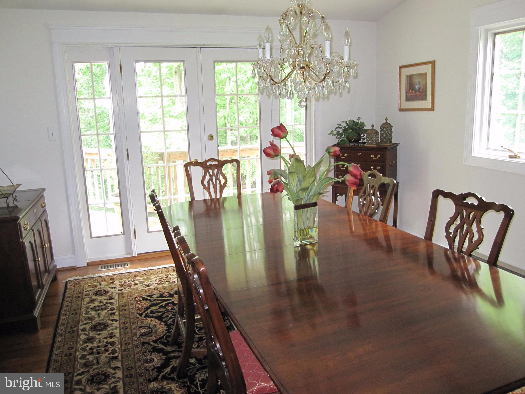 906 Huntsman Road Baltimore, MD 21286 - Photo 10 of 30 a view of a dining room with furniture window and wooden floor