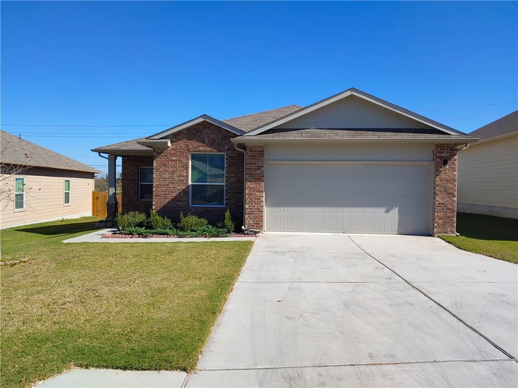 636 Donegal Lane Georgetown, TX 78626 - Photo 1 of 15 a front view of a house with garden