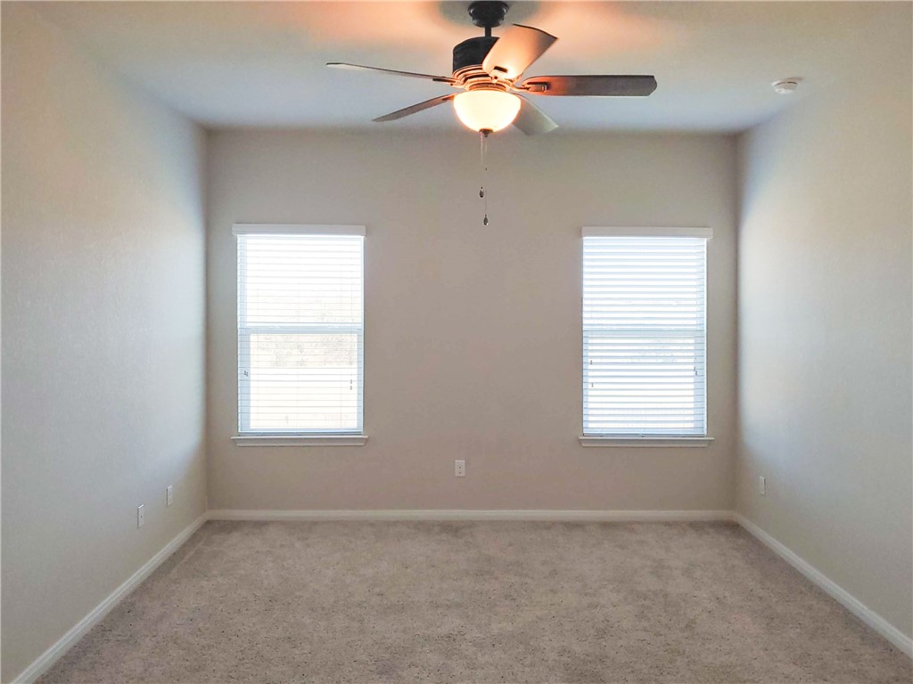 636 Donegal Lane Georgetown, TX 78626 - Photo 7 of 15 an empty room with a window and a fan