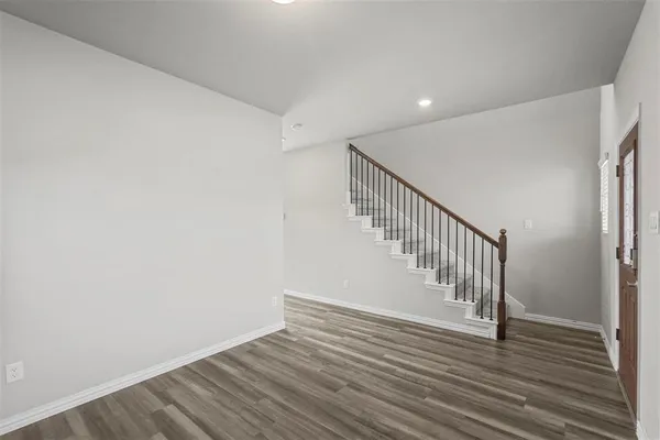 a view of entryway with wooden floor