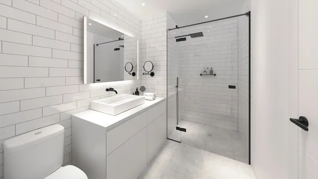 a bathroom with a sink toilet and shower