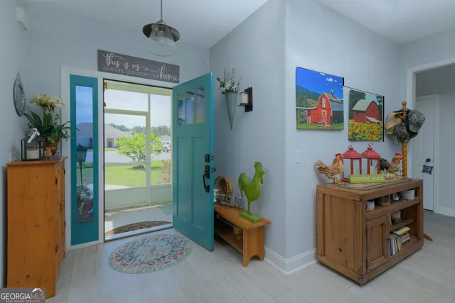 a bedroom with furniture and a window