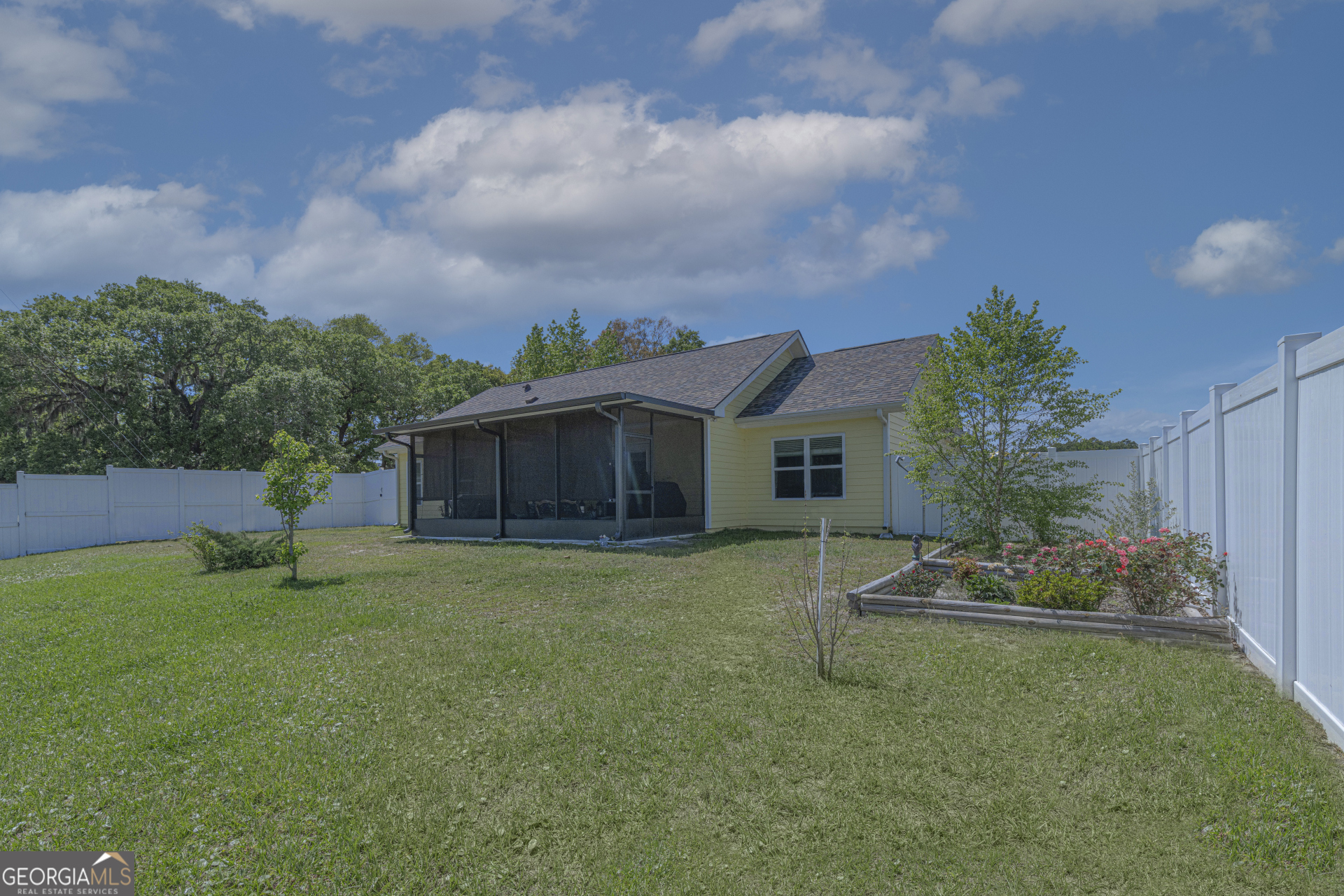 107 Elmo H Circle St. Marys, GA 31558 - Photo 19 of 31 a front view of a house with garden