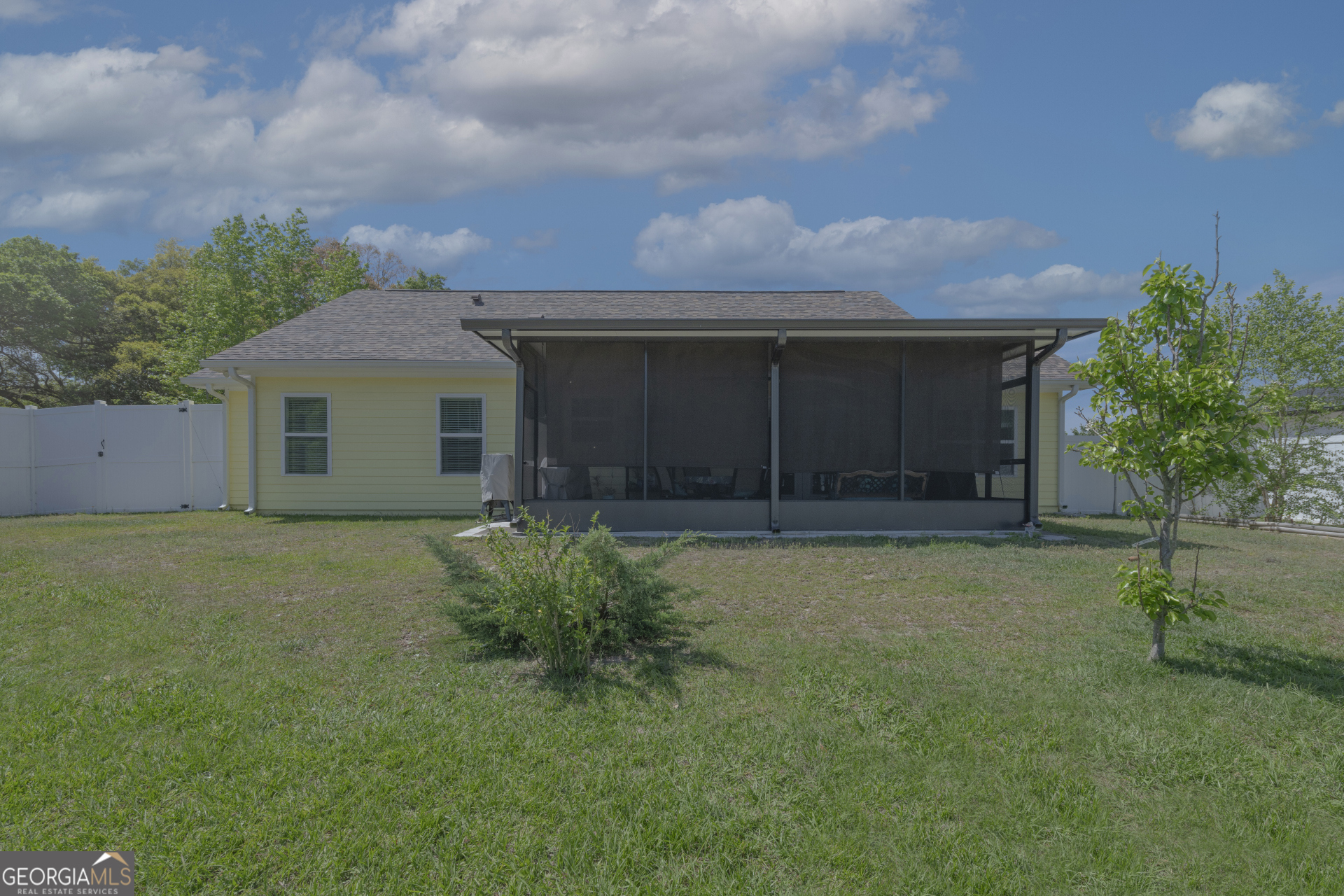 107 Elmo H Circle St. Marys, GA 31558 - Photo 20 of 31 a front view of a house with garden