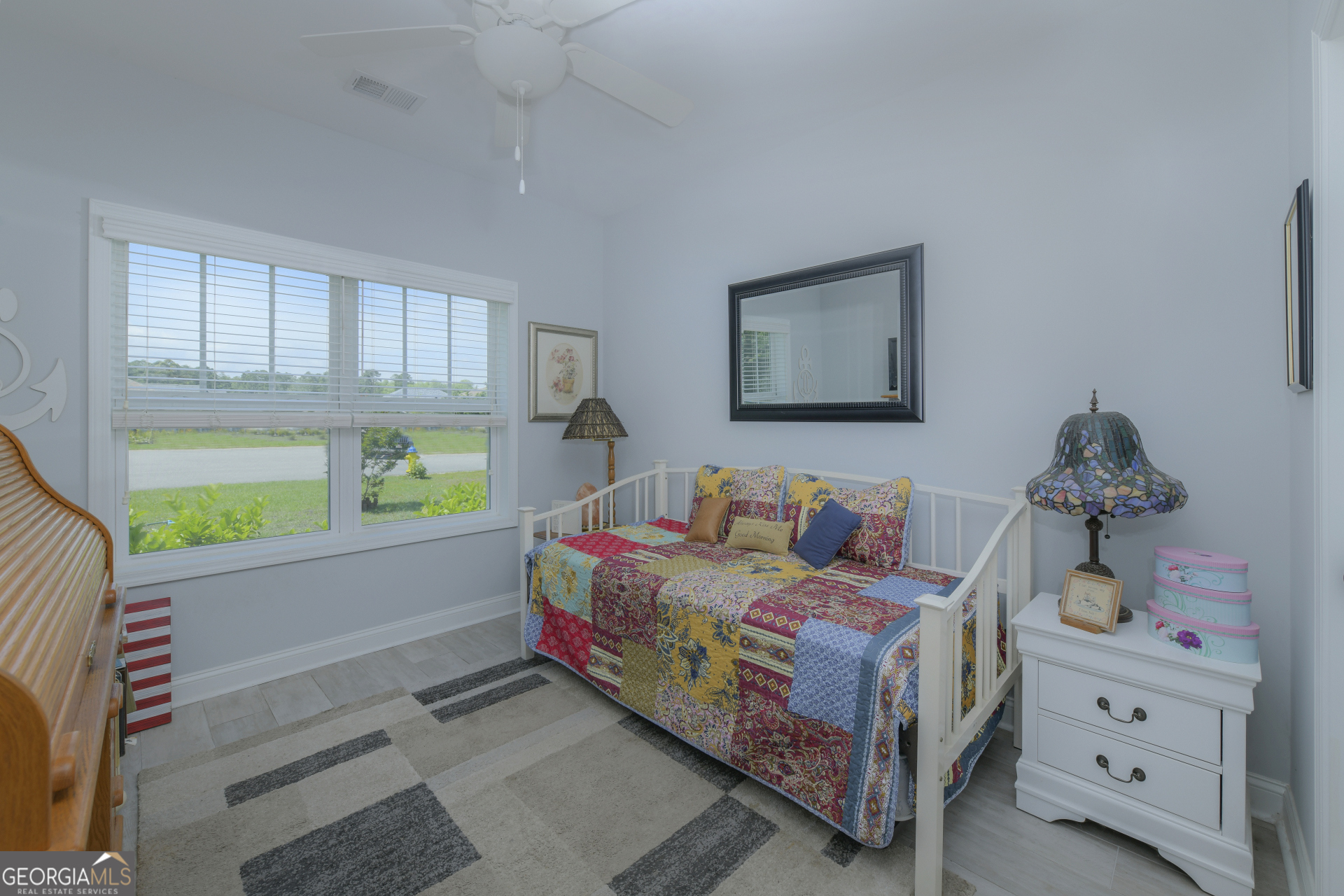 107 Elmo H Circle St. Marys, GA 31558 - Photo 22 of 31 a bedroom with a bed and a window