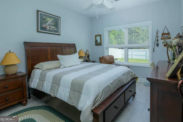 a bedroom with bed and a window