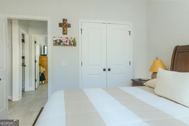 a bedroom with a bed and a couch