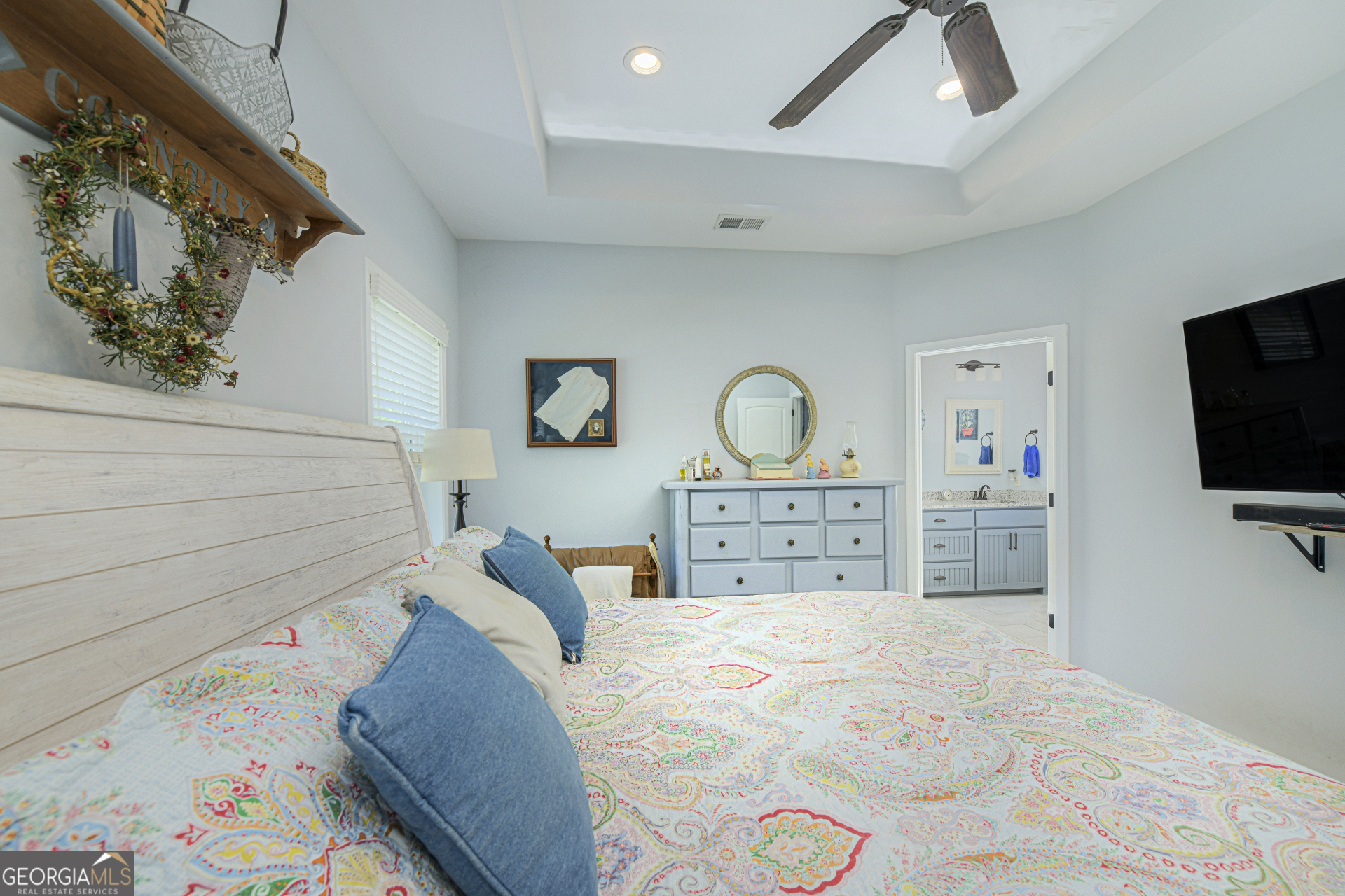 107 Elmo H Circle St. Marys, GA 31558 - Photo 28 of 31 a bedroom with a bed and flat tv screen on the dresser