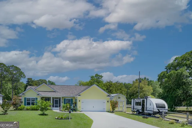 a aerial view of a house with a yard