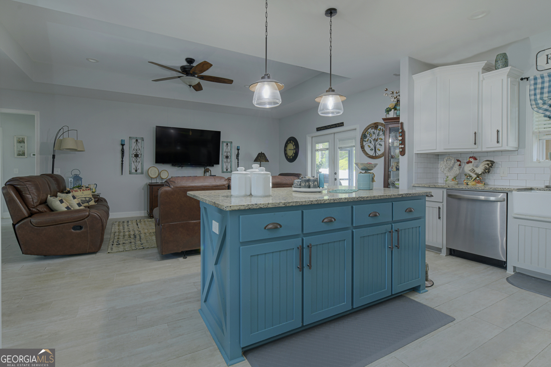107 Elmo H Circle St. Marys, GA 31558 - Photo 8 of 31 a large kitchen with cabinets a stove and a view of living room