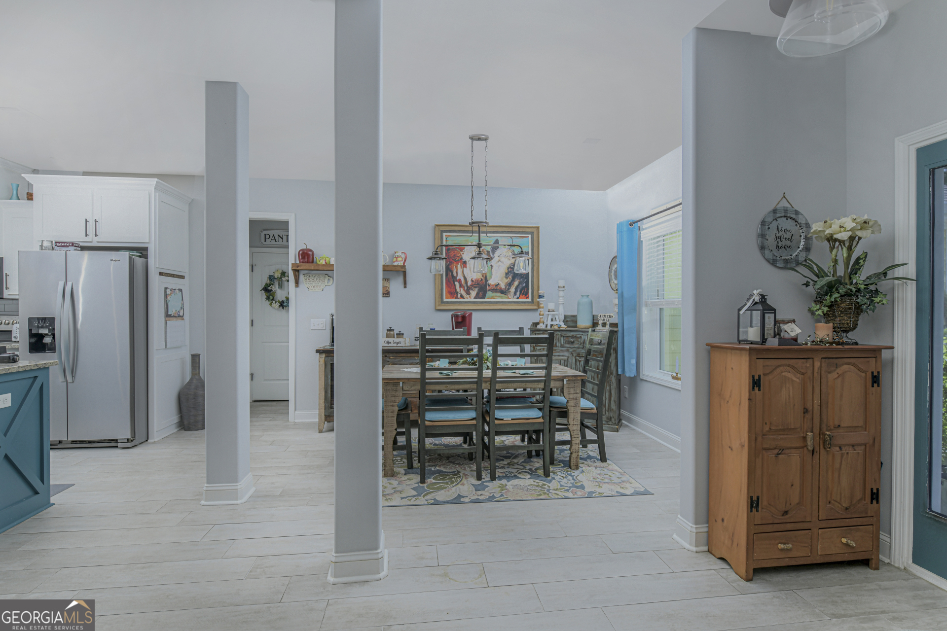 107 Elmo H Circle St. Marys, GA 31558 - Photo 10 of 31 a dining room with furniture and a chandelier