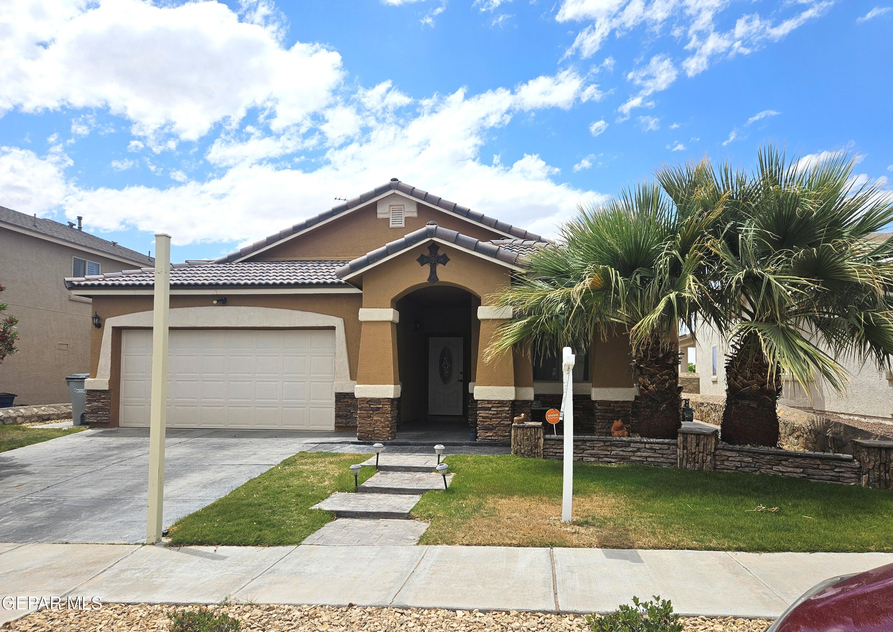 a front view of a house with garden