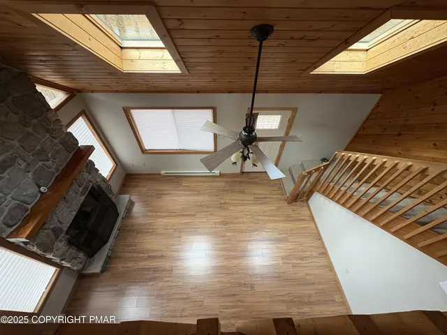 a view of an entryway and wooden floor