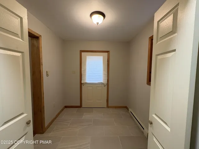a view of hallway with a window