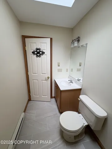 a bathroom with a toilet sink and shower