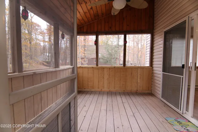 a view of a room with wooden floor and outdoor space